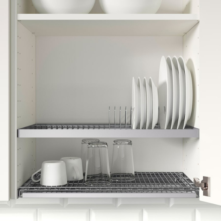 A stainless steel dish rack mounted in a wall cabinet
