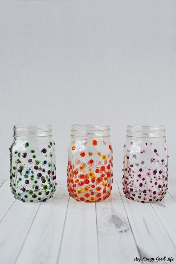 Glass jars with colorful, paint polka dots