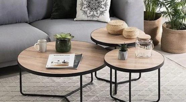 Three coffee tables, of different sizes, placed side-by-side in a living room