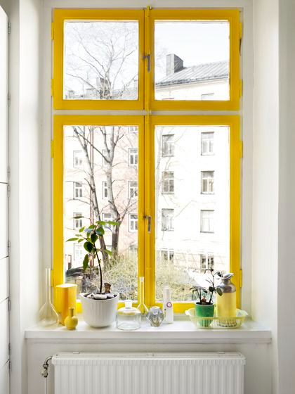 Window frames painted in canary yellow