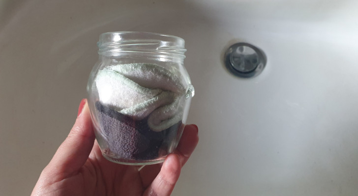 A glass jar with wet-wipes inside it