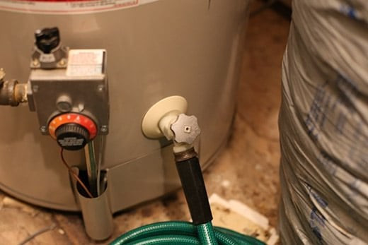 closeup of the taps and knobs on a water heater