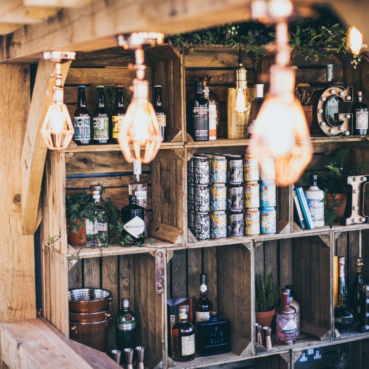 closeup of the wall of a corner-bar constructed using wooden boxes