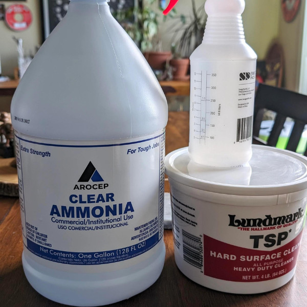 A jug of ammonia placed alongside other detergents