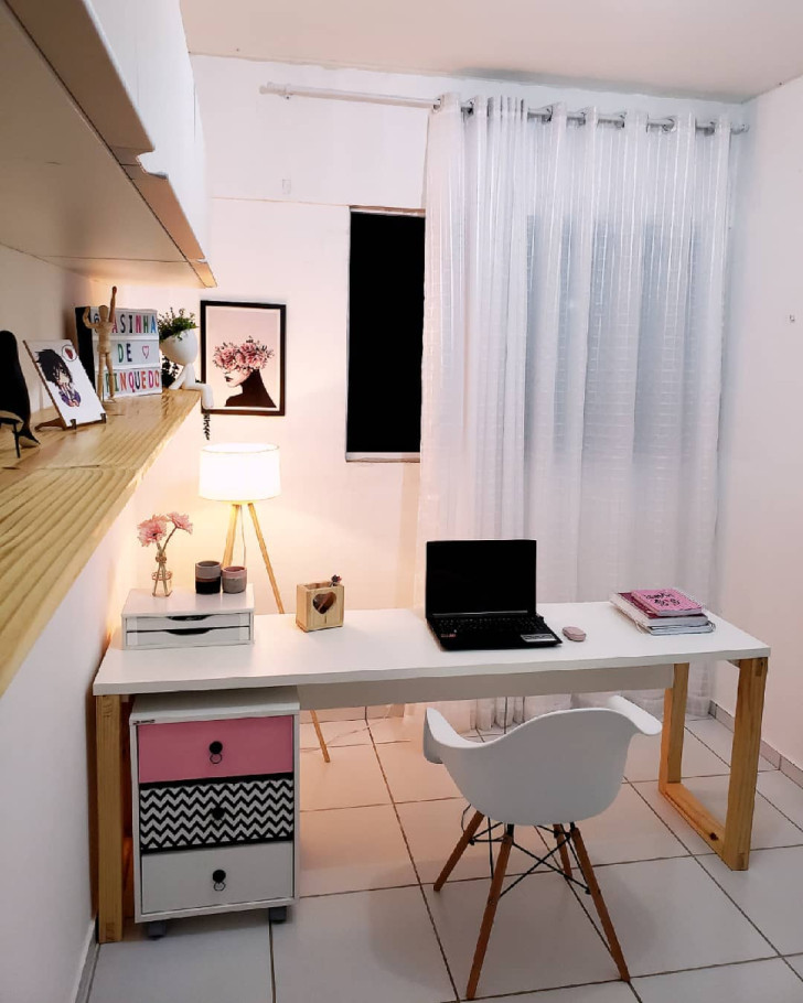 A brightly colored chest of drawers brightens up a minimalistically-styled home office