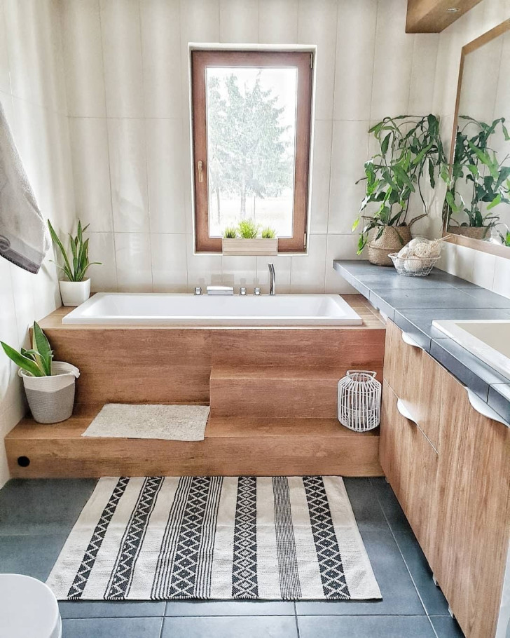 A bathroom entirely furnished in natural wood and enhanced with potted plants