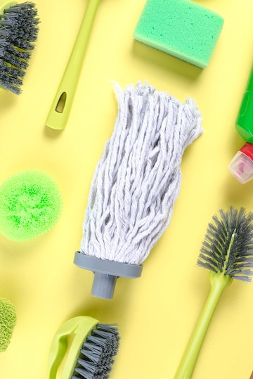 cleaning tools on yellow graphic background