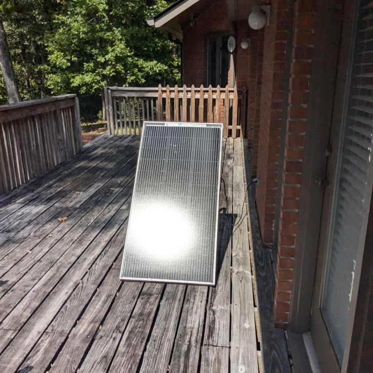 A plug and play solar panel installed on a balcony exposed to direct sunlight