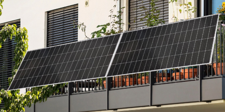 Plug-and-play solar panels mounted on a balcony railing