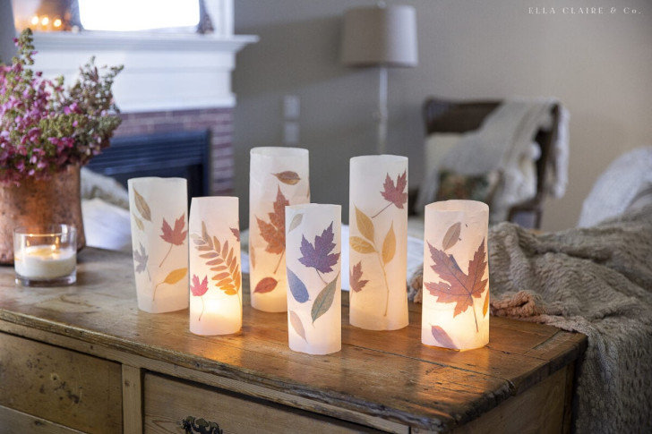 Autumn lanterns made with parchment paper and colorful leaves