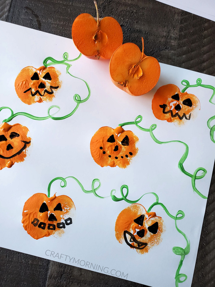 Pumpkins and pumpkin stalks painted by using an apple cut in half