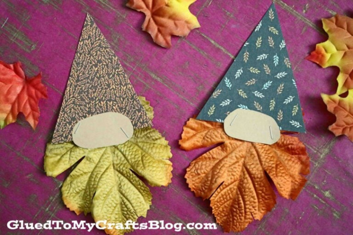 Autumn gnomes made with cardboard and colorful leaves