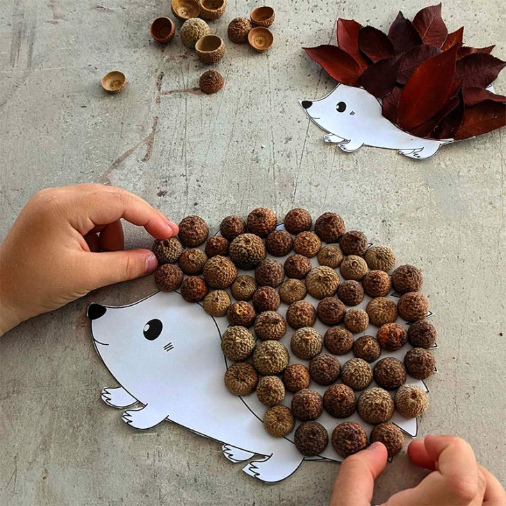 Cardboard hedgehogs decorated with leaves and acorns