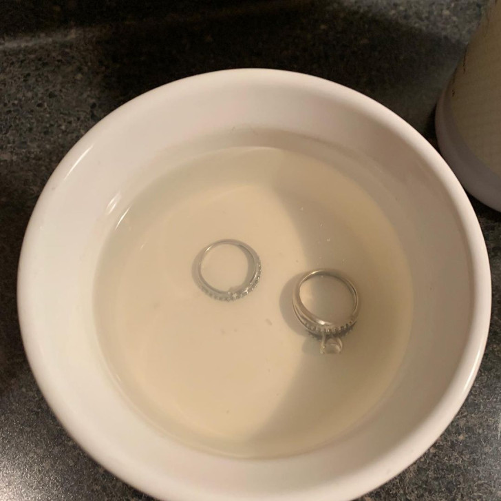 Two rings soaking in a bowl of hot water