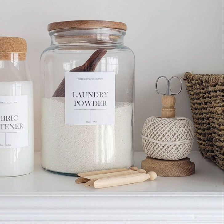 A glass jar with a label for DIY laundry detergent