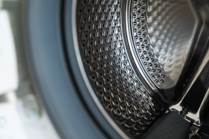 a clean, shiny washing machine drum