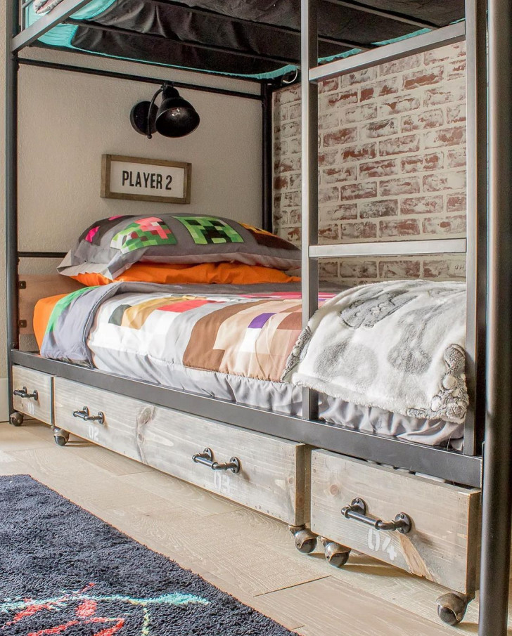 A bed with wooden storage drawers on wheels