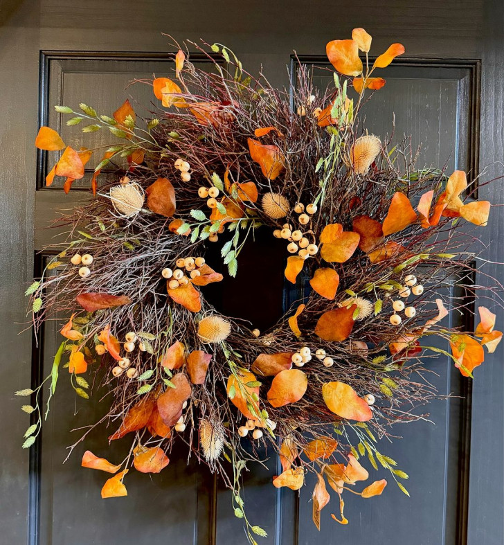 Wreath of branches displaying yellow-orange foliage