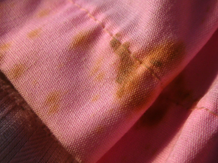 Pink fabric with a stubborn stain on it