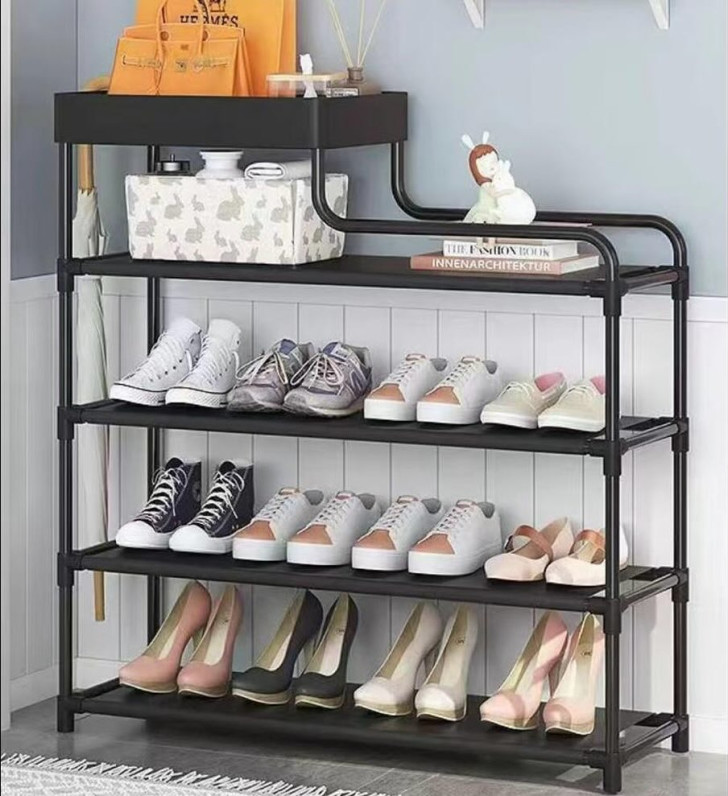 A shoe rack at the entryway of a house