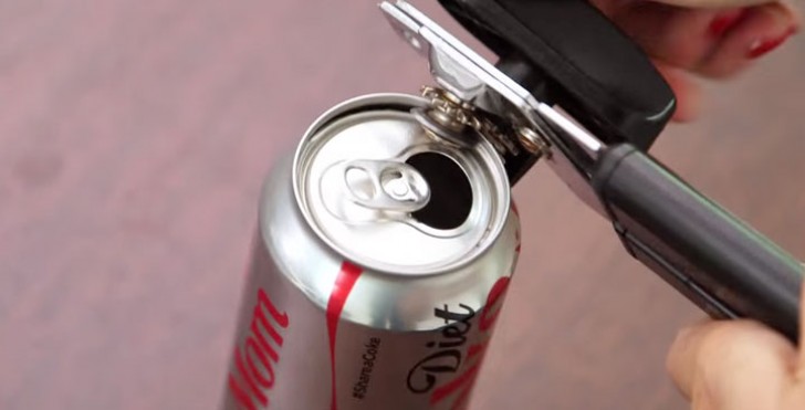 5. With the help of a can opener, remove the upper part of a can.