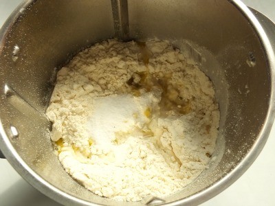 We start with the dough: Put all ingredients in a food processor or knead by hand using a large bowl.