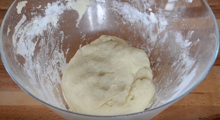Then add the flour and continue to work the mixture until it is a malleable dough. 