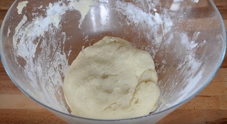 Then add the flour and continue to work the mixture until it is a malleable dough.