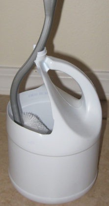 Plastic detergent containers are ideal for upcycling into toilet brush holders!