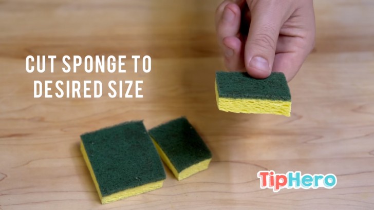 Take a sponge and cut two pieces that are small enough to easily enter the opening of your decanter.
