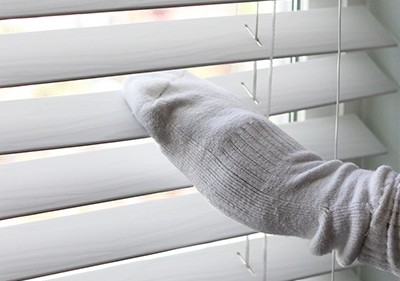 5. To clean blinds, just pass a sponge sock between the slats! All the dust collected will remain on the sock!
