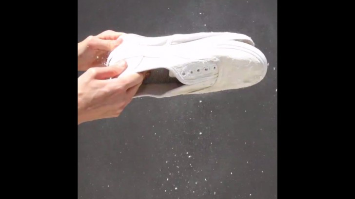 Put your shoes out to dry in the sun for three or four hours. Then beat them vigorously together to remove the white crusty film that has formed.