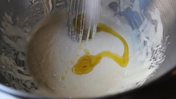 Add the olive oil and salt and stir with a whisk.