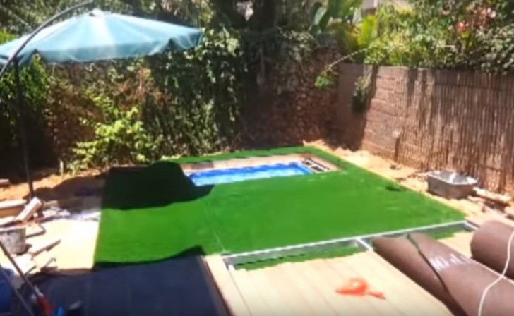 7) Laying the artificial grass --- two separate portions of artificial grass were cut. One was for the movable panel covering and the other was laid around the swimming pool area.