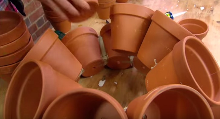 Let dry and then you can begin to position the second layer of pots in the same way as the first using glue and silicone.
