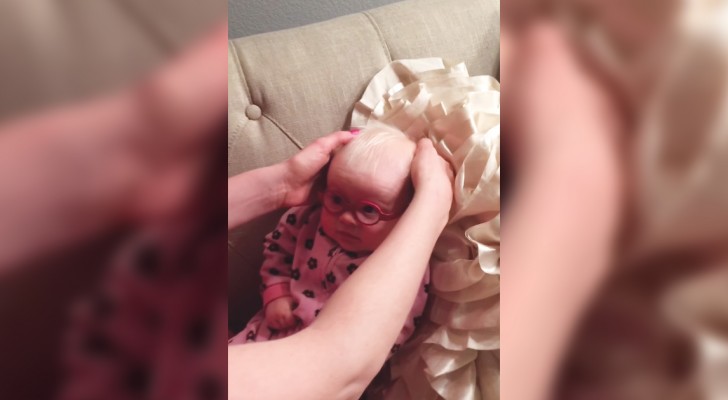 A baby can see her mother's face for the first time!