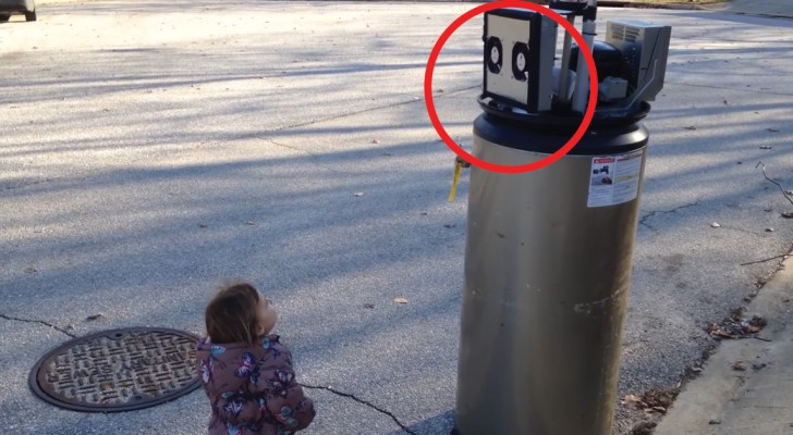 A friendly child meets her first "robot"!