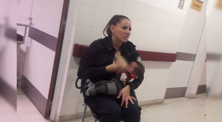 An Argentinean policewoman nurses the child of a woman who had been arrested and for her kind gesture she was promoted