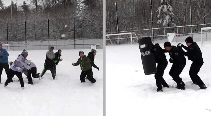 Questi agenti in tenuta antisommossa rimangono coinvolti in una dura ma esilarante battaglia di palle di neve