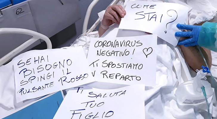 Coronavirus: gli infermieri comunicano con i pazienti non udenti scrivendo dolcissimi messaggi su dei cartelli