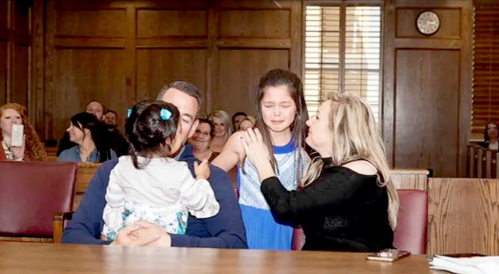 A little girl bursts into tears when she sees that all her classmates are there on the day of her adoption