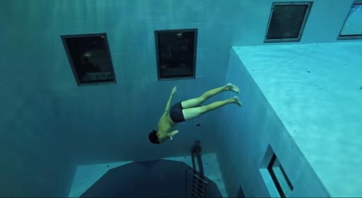 A man dives in one of the deepest pools in the world. AWESOME !