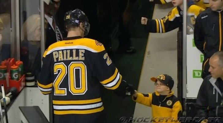 This young fan gets to bump Boston Bruins players. ADORABLE !