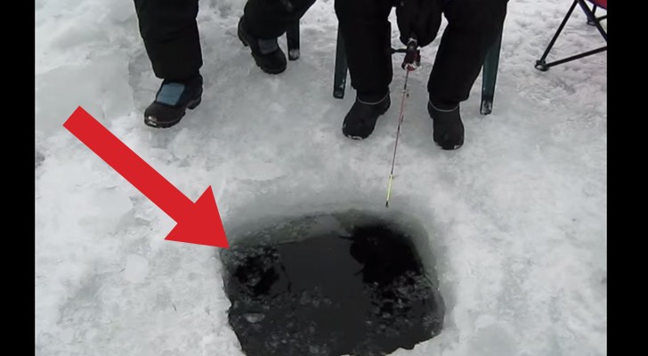 Some people are ice fishing : you won't believe what comes out of the hole!!