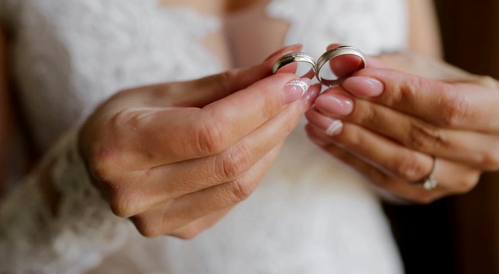 The groom's lover shows up at the wedding reception with a white dress and a wedding ring