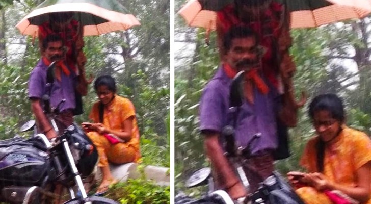 Ce père tient un parapluie pour sa fille afin qu'elle puisse suivre ses cours en ligne sous la pluie