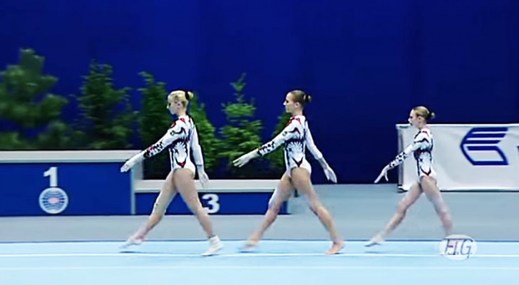 3 gymnasts begin their performance and the audience is amazed by their skill