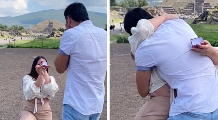 Mädchen macht ihrem Freund einen Heiratsantrag, kniend in der Öffentlichkeit: Beifall folgt