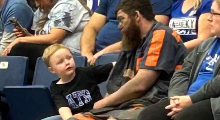 Father finishes his work at the mine and runs to a game to be with his son: he was still wearing his dirty work clothes