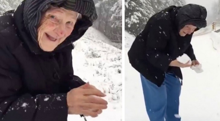 En mamma som är över hundra år gammal roar sig med att kasta snöbollar: 